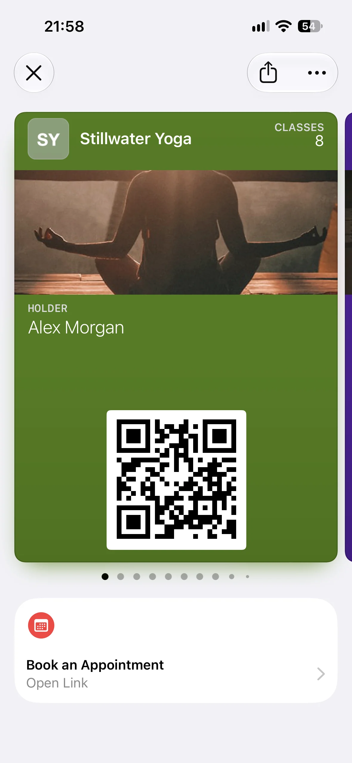 A Stillwater Yoga membership pass in Apple Wallet with the Book an Appointment Featured Action beneath it