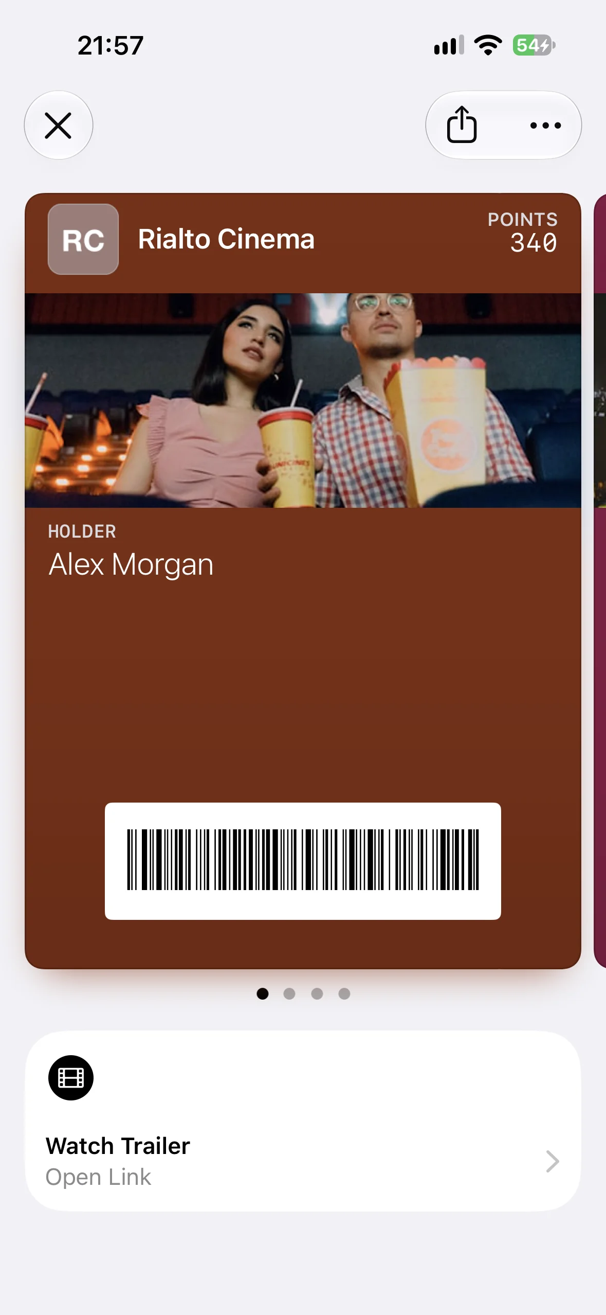 A Rialto Cinema pass in Apple Wallet with the Watch Trailer Featured Action beneath it