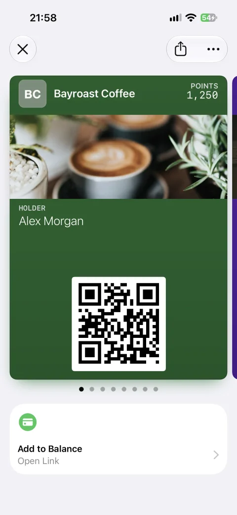 A Bayroast Coffee loyalty pass in Apple Wallet with the Add to Balance Featured Action and pass carousel indicator beneath it